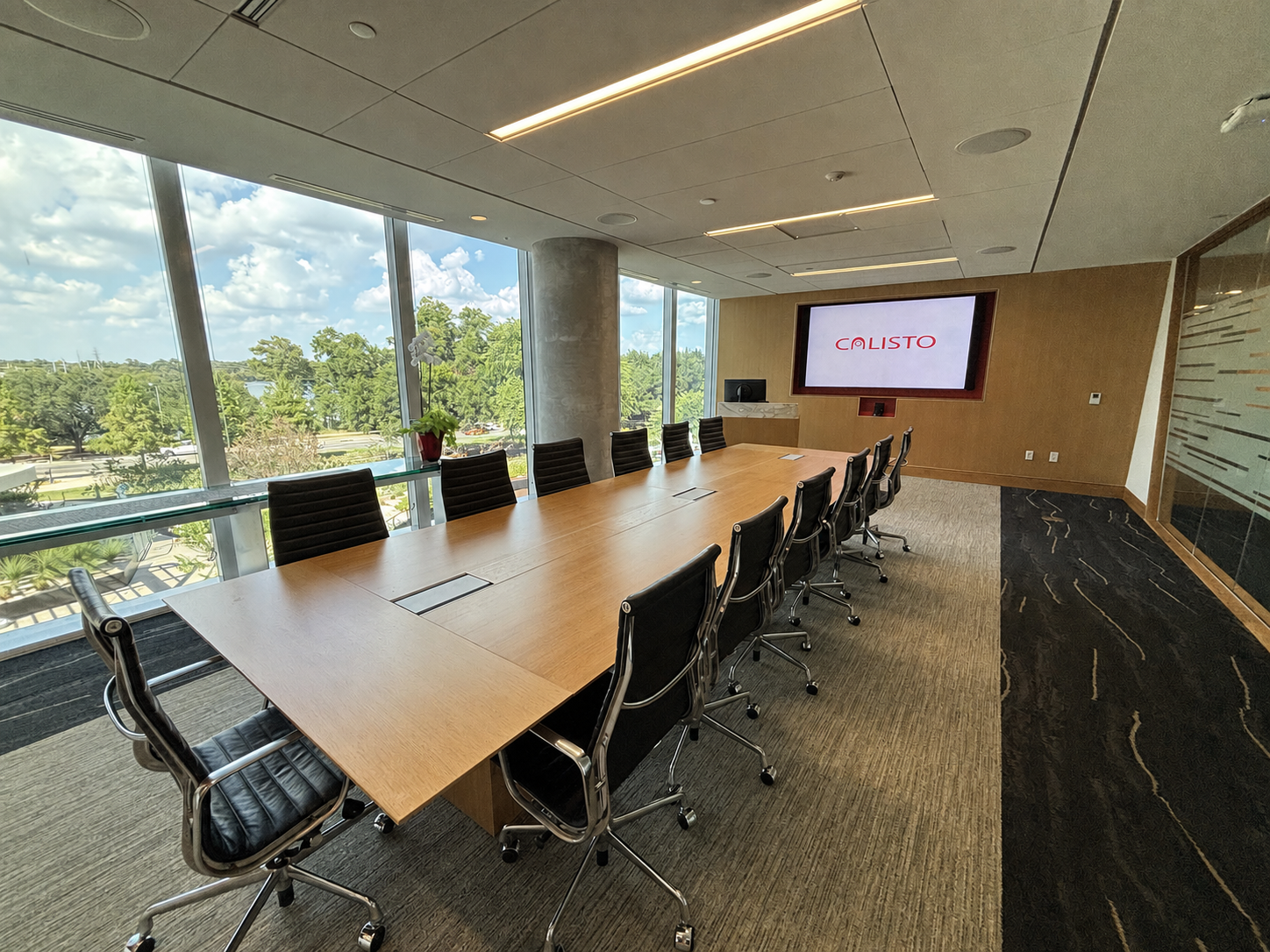 Calisto Corporation conference room with integrated audio-visual display